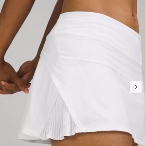 Play Off The Pleats Mid Rise Skirt